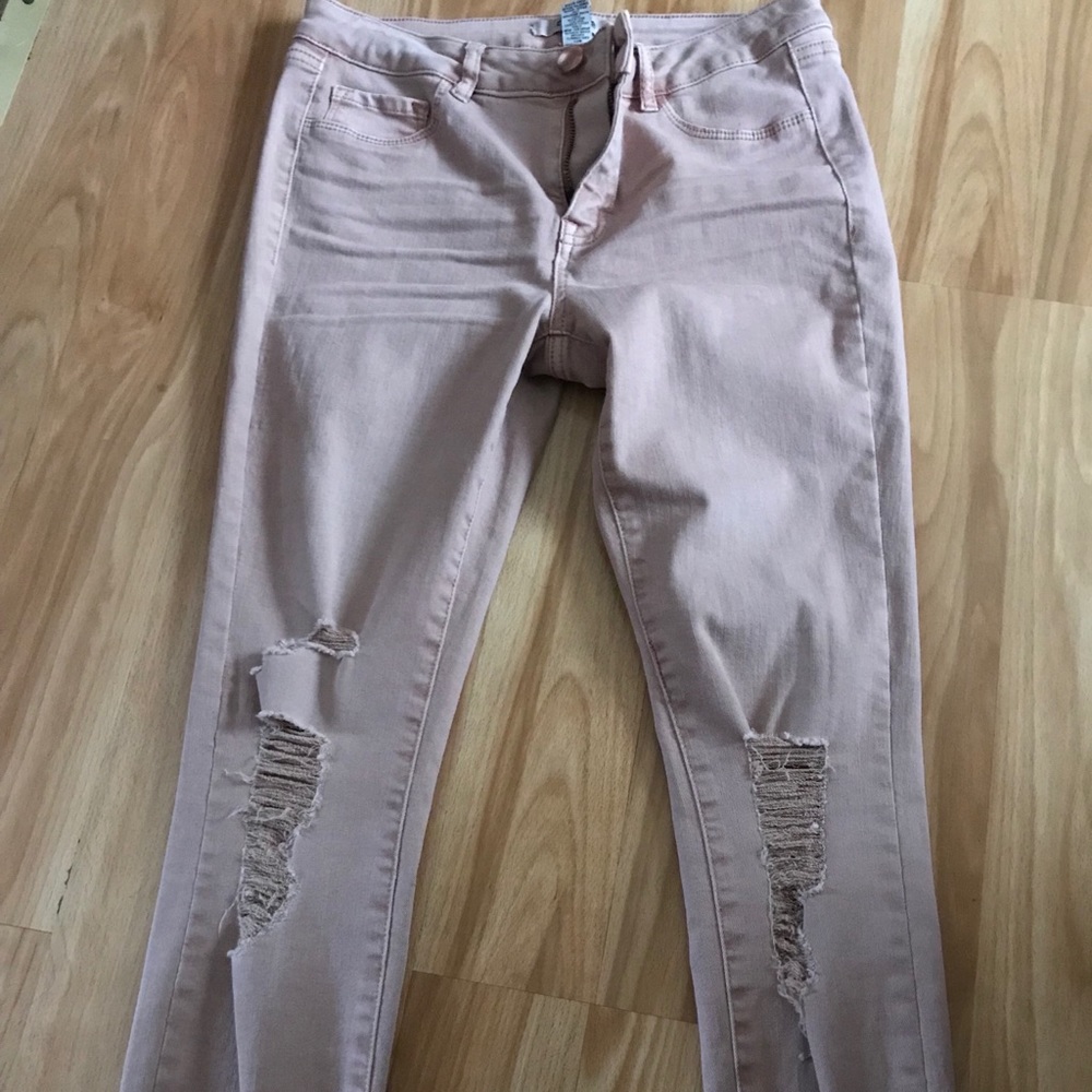 Light pink distressed skinny jeans